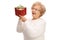 Delighted mature woman holding a present