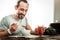 Delighted positive man having breakfast in the morning