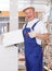 Delighted worker with ceramic tile