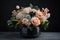 delightful arrangement of pastel blooms, arranged in chic black vase