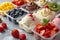 The Delightful Array Of Creamy Ice Cream Flavors Topped With Fresh Fruit - A Perfect Summer Dessert