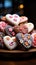 Delightful confections Heart shaped glazed cookies adorned with flower patterns on a wooden stand