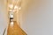 Delightful corridor with brown parquet flooring