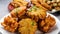 A delightful display of pakoras, crispy fritters made with various ingredients