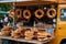 A delightful display of various doughnut flavors, neatly arranged on a table, ready to be savored, A food truck at a beer festival