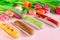 Delightful eclairs and vibrant tulips and muscari flowers. Concept baking, cookbook recipes, bakery banner, cafe advertisement.