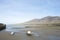 Delightful landscape of small beach at Trefor, north Wales, with two small boats at low tide