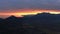 A delightful spectacle of the mountain panorama at sunset after a thunderstorm. Silhouette of a mountain range