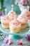 Delightful Vanilla Cupcakes With Pink Frosting and Lit Candles on a Celebration Table