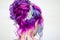 Delightfully bright colored hair, multi-colored coloring on long hair. An elegant high hairstyle