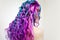 Delightfully bright colored hair, multi-colored coloring on long hair. The stylish, contemporary styling of curls.