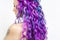 Delightfully bright colored hair, multi-colored coloring on long hair. The stylish, contemporary styling of curls.