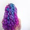 Delightfully bright colored hair, multi-colored coloring on long hair. The stylish, contemporary styling of curls.