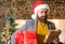 Delivery christmas present. Christmas gift. Man santa hat hold gift. Delivery service. Spread happiness and joy. Bearded