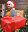 Delivery christmas present. Delivery service. Christmas is coming. Santa courier. Gifts delivery. Man santa hat deliver