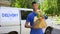 Delivery company worker holding grocery bag, food order, supermarket service