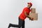 Delivery Concept - Handsome African American delivery man rush running for delivering a package for customer. Isolated