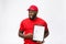 Delivery Concept - Portrait of Handsome African American delivery man or courier showing a confirmation document form to