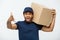 Delivery Concept - Portrait of Serious African American delivery man showing silly aggressive expression with holding a