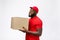 Delivery Concept - Side view Portrait of Happy African American delivery man in red cloth holding a box package