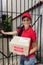 Delivery courier or mailman delivering package