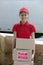 Delivery courier or mover delivering cardboards