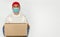 Delivery employee delivering cardboard box in medical gloves and mask.Ð¡oncept of safety mail goods courier delivery in virus or