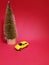delivery of gifts  by couriers for Valentine's Day, yellow car on a red background, concept of a taxi and delivery