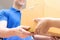 Delivery man in blue uniform handing parcel boxes to recipient