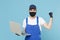 Delivery man in cap t-shirt uniform sterile mask gloves isolated on blue background studio. Guy employee courier hold