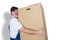 Delivery man carrying large heavy cardboard box