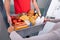 Delivery Man Giving Grocery Box To Woman