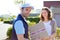 Delivery man handing over a parcel to customer