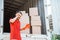 Delivery man having headache at work behind container truck