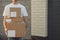 Delivery man hold blank boxes outdoor