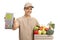 Delivery man with a payment terminal and a crate filled with groceries