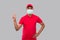 Delivery man Showing Peace Sign Wearing Medical Mask Isolated. Indian Delivery Boy Smilling Peace