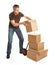 Delivery man staking packages on hand truck