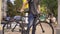 Delivery man standing with bike and yellow bag in medical mask