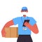 Delivery man in uniform with cardboard box wearing mask to prevent coronavirus pandemic self isolation labor day