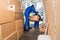 Delivery Men Loading Cardboard Boxes