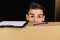 Delivery and moving in concept: man hiding behind cardboard boxes