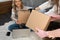 Delivery package holding parcel cardboard shipping cargo spreading online concept. shallow focus box blurring off togirl