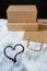 Delivery packing bag box craft pack flour meal heart table black background