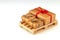 Delivery presents in three boxes with red ribbon on pallet for goods and logistics upper and beside from corner horizontal