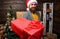 Delivery service. Christmas is coming. Santa courier. Gifts delivery. Man santa hat deliver gift. Spread happiness and