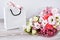 Delivery service packing bouquet flowers pink white background gift shipping. Beautiful romantic composition with flowers. St.