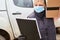 Delivery service parcel carrier with face mask checks list