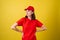 Delivery service worker woman in red cap, blank t-shirt, uniform