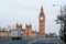 A delivery truck crosses Westminster Bridge at dawn in London, UK